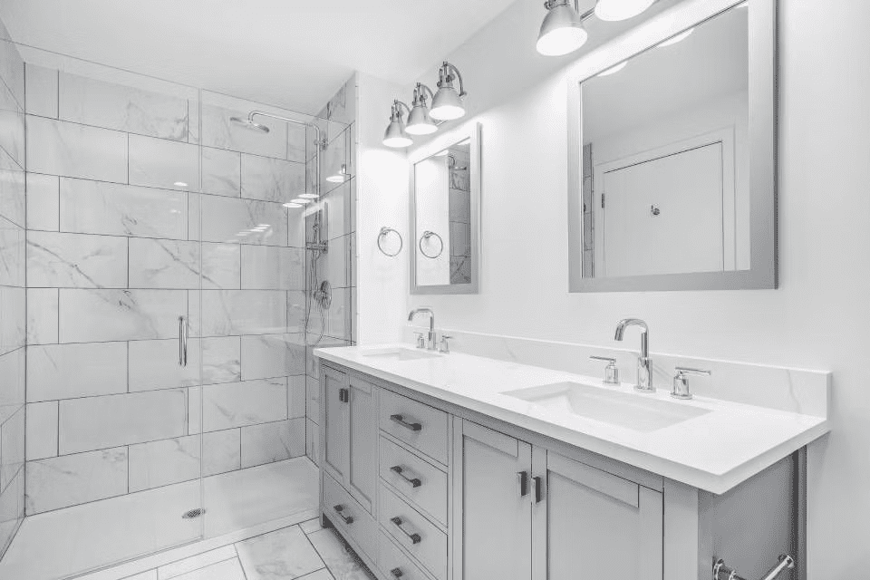 remodeled-bathroom-with-a-grey-vanity-and-bronze-hardware